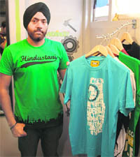 Preet Arjun Singh displays t-shirts designed by him