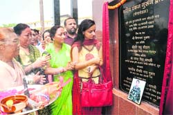 Madhu Chauhan, Chairperson of the Dehradun Zila Panchayat, inaugurates Shaheed Pankaj Gurung Gate at Johri village near Dehradun on Sunday. 