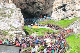 Pilgrims outside the holy cave at the end of the journey