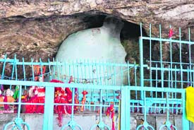 A view of  the holy Ice Lingam inside the cave