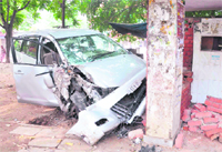 The badly damaged vehicle of a councillor after it crashed into a bus queue shelter at Phase V of Mohali 