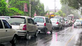 A traffic jam due to heavy rain in Dehradun on Monday.