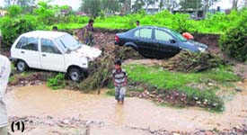 Two cars which were swept away by rainwater killing three persons at the Tibdi bypass