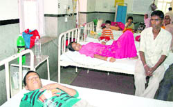 Children who fell ill after consuming contaminated laddoos get treatment at SMGS Hospital in Jammu on Monday.