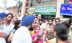 Deep Hospitals director trying to pacify the grandmothers outside the hospital. 