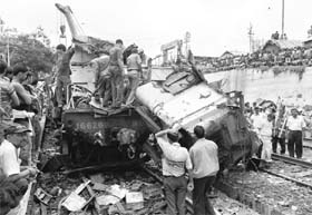Rescue workers at the accident site at Sainthia on Monday.