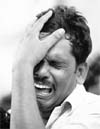 A man wails the loss of his relatives