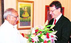 Haryana Chief Minister Bhupinder Singh Hooda greets German Ambassador Thomas Matussck at his residence in Chandigarh on Tuesday.