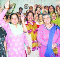 Suman Verma (centre) along with her jubilant supporters after winning the district Congress president election at Dharamsala
