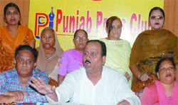 Members of Ishwar Nagar Welfare Society address the press in Jalandhar