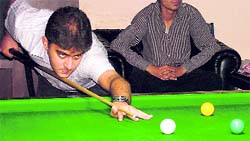 A player in action during the Punjab State Snooker Championship in Ludhiana 