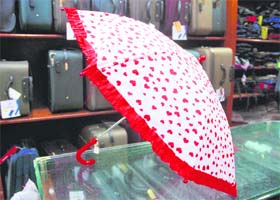 Red and white umbrella: Rs 150