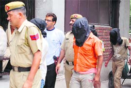 Members of the notorious gang, who were planning to strike in the town, being produced by the police at
