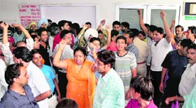 Patients and their attendants raise slogans against the GMSH authorities in Chandigarh on Wednesday