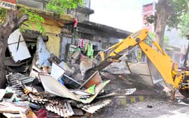 An encroachment being pulled down