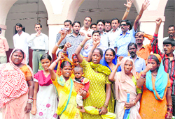 Residents of slum areas hold a protest in Dehradun
