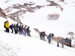 Kailash Mansarovar pilgrims crossing in snow in Tibet.
