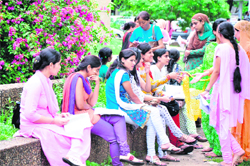 Candidates wait for their turn in front of fee counters at University of Jammu