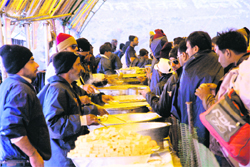 Pilgrims partake of langar organised en route the Amarnath cave shrine.