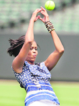 First lady Michelle Obama tries to deflect a ball thrown to her, while participating in the Let's Move campaign, which promotes exercise and healthy eating for America's youth, in Baltimore. 