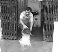 A resident of Housing Board Colony drains out water from his house in Ambala Cantt on Thursday.
