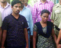 The police produces the couple involved in the murder of an elderly woman in New Delhi on Thursday.