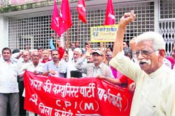 Seeking strengthening of the public distribution system, CPM workers hold a demonstration at the district headquarters in Dehradun on Thursday. 