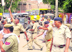  The police chases away protesters at Fountain Chowk in Hisar on Thursday.