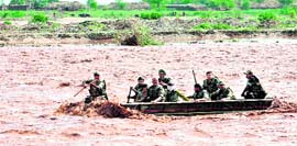 Army jawans rescue stranded persons in the Tawi in Bhagwati Nagar in Jammu on Thursday