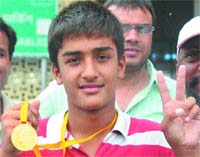 Deshdeep shows his gold medal, won at the Sub-Junior National Aquatic Championship held in Bangalore.
