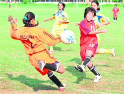 Players of Sikkim and Haryana vie for the ball during a match in Chandigarh on Friday.