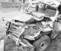 The mangled remains of the Jeep after an accident with a truck on the Ambala-Chandigarh highway at Zirakpur on Friday.