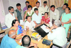 Members of the Uttarakhand Kranti Dal and ex- servicemen bodies at the office of the Uttarakhand Police Complaint Authority in Dehradun on Friday.