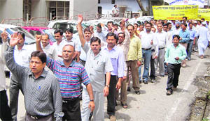 Employees of the Revenue Department hold a protest march in Dehradun on Friday.