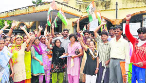 Residents hold a protest to demand compensation for losses due to rain in Haridwar on Friday.