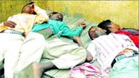 Unconscious labourers in the train.