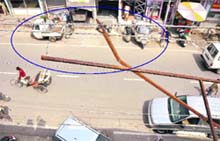 The iron grills (encircled) where the fallen hoarding was installed close to overhead high-tension wires.