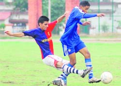 A match in the Dehradun Football League being played at the Police Lines ground in Dehradun on Saturday.