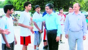 Vimal Kumar and KS Bhandari meet the players at the BHEL Sports Club in Haridwar on Saturday.