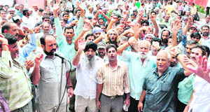Employees of the Public Health Engineering Department protest in favour of their demands in Jammu on Saturday.