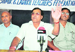 Members of the All Jammu, Kashmir and Ladakh Teachers Federation address mediapersons in Jammu on Saturday.