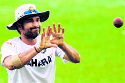 Sachin Tendulkar waits to catch a ball during a training session on Saturday