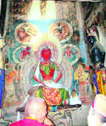 The mud walls and the rare thangka paintings (L) of the monastery are in danger due to the seepage of moisture