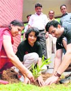 Faculty members of the PGI plant a sapling at Sector 24 Community Centre in Chandigarh on Sunday.