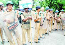 Police personnel deployed on the Kanwar mela duty in Haridwar on Sunday.