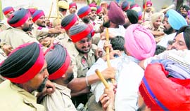Rural health pharmacists clash with the police after the former attempted to block the passage leading to the house of the Rural Development and Panchayat Minister in Amritsar on Sunday.