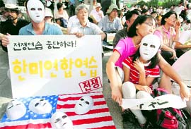 South Koreans at a rally held against a joint exercise between South Korean and US military near the US Embassy in Seoul on Sunday