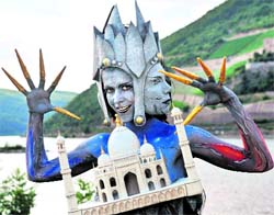 A woman painted as an Indian goddess poses at the International body paint festival in Bingen (Germany)