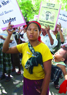 Myanmar pro-democracy activists protest against the visit of Myanmar leader Than Shwe in New Delhi on Monday.
