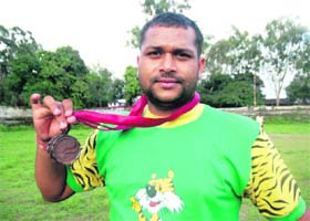 Prem Kumar with his bronze medals in Dehradun